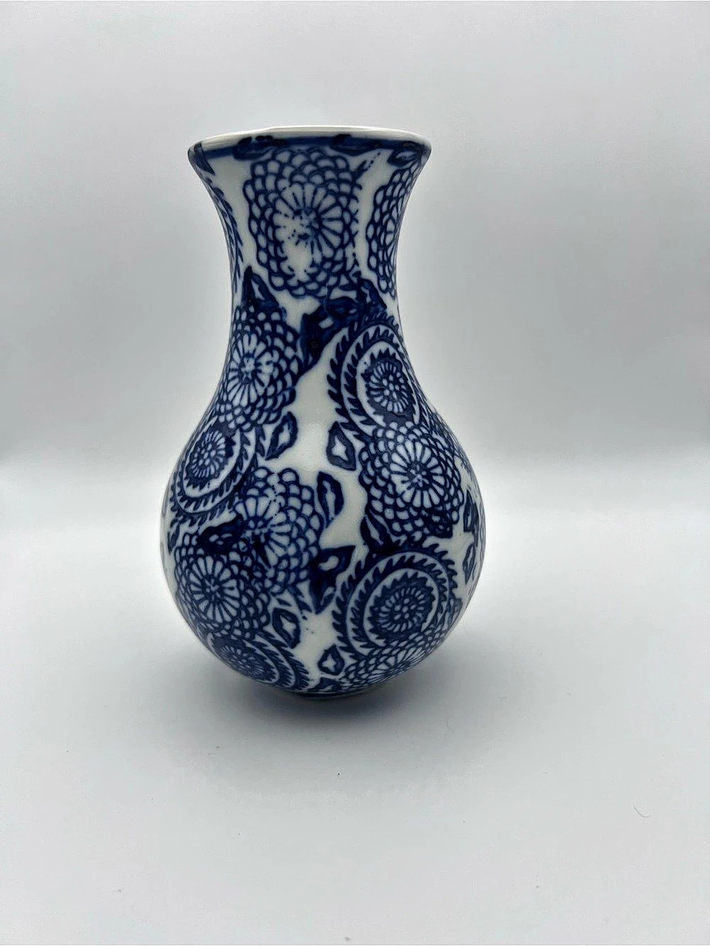Blue & White Floral Ceramic Vase Blue and white porcelain bud vase featuring a f
